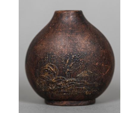 A Chinese terracotta snuff bottleEach side decorated with pagodas in a landscape, the underside with impressed seal mark.  5.