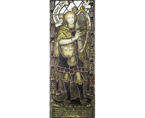 An early 20th century leaded stained glass window panel, in the manner of Margaret Agnes RopeDepicting a figure holding a lyr