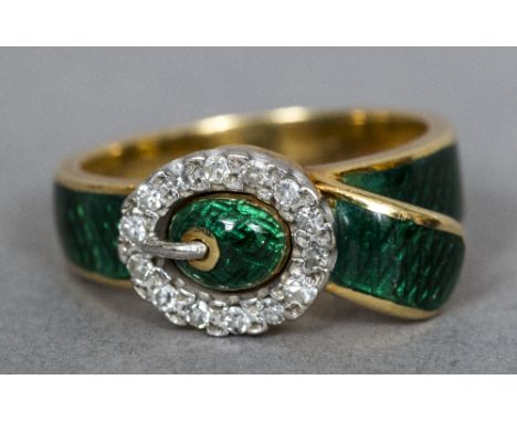 An 18 ct gold diamond and enamel ringFormed as a buckle. CONDITION REPORTS: Two small areas of damage to enamel, general wear