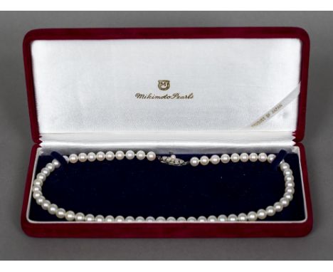 A boxed Mikimoto cultured pearl necklace40 cm long; together with newspaper cut-out detailing Mikimoto's Marilyn Monroe repli