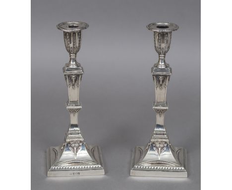 A pair of Victorian silver candlestick, hallmarked Sheffield 1892, maker's mark of Mappin & WebbOf square section with knoppe