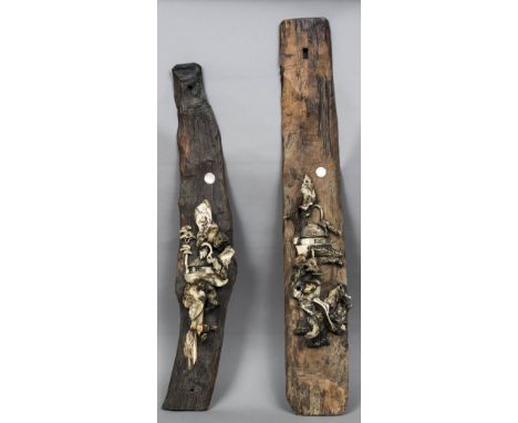 A pair of Japanese carved bone mounted and mother-of-pearl inset wood wall plaquesEach worked with a cottage in a stylised mo