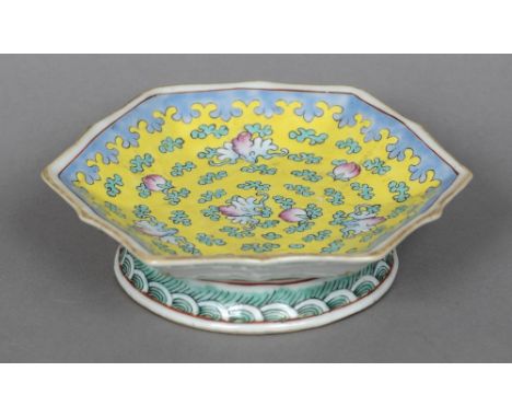 A Chinese porcelain yellow ground low tazzaDecorated with floral sprays and a blue lappet border, the underside with iron red