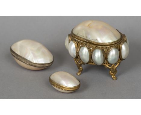A late 19th century French mother-of-pearl shell mounted casketThe hinged lid inscribed Souvenir de Trauville; together with 
