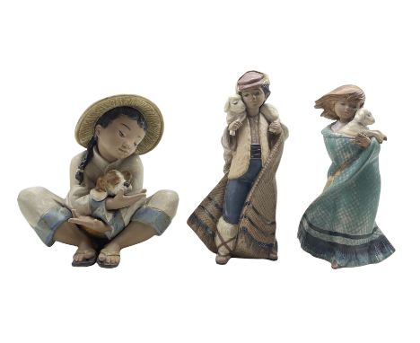 Pair of Lladro Gres figures from the Children with Animals series 'Mountain Shepherd' No2163 and 'My Lost Lamb' No2164 H22cm 