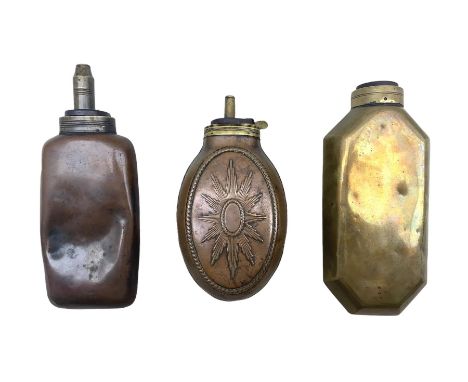 Two bottle shaped powder flasks in copper and brass and other powder flask of oval form, L17.5cm max (3)