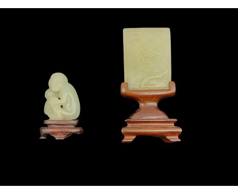 Chinese jade tablet with incised bird, cat etc 5cm x 3.5cm and a carved jade group of two monkeys H4cm