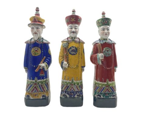 Three Chinese Republic figures 'The Three Emperors', each dressed in yellow, red and blue robes, some a/f H38cm 