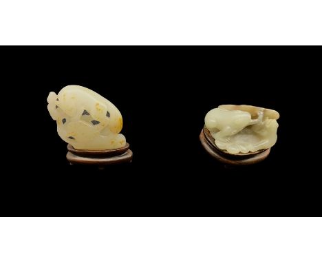 Chinese jade carved as two frogs W5cm and another carved as a fox on a rock W4.5cm