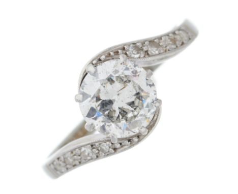 A mid 20th century 18ct gold and platinum, circular-cut diamond single-stone ring, with single-cut diamond line asymmetric sh