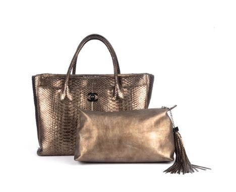 Chanel, a python skin Cerf Executive Tote handbag, designed with a metallic bronze python skin exterior, featuring dual rolle