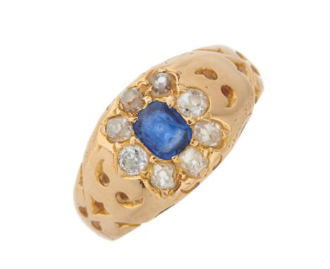 An early 20th century 18ct gold cushion-shape sapphire and old-cut diamond cluster band ring, with pierced shoulders, estimat