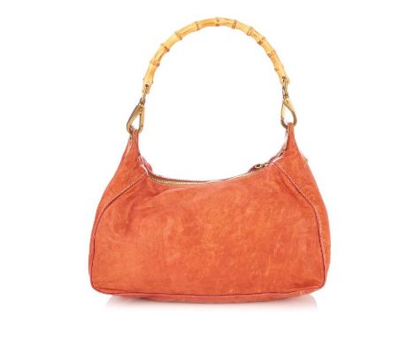 Miu Miu, a bamboo hobo handbag, designed with a peach leather exterior, with brushed gold-tone hardware, detachable bamboo ha