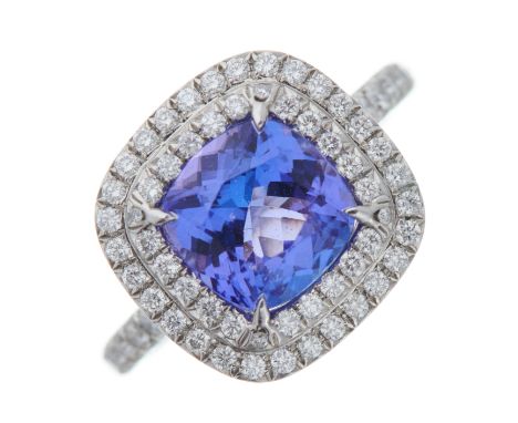 Tiffany & Co., a platinum cushion-shape tanzanite and brilliant-cut diamond Soleste cluster ring, with similarly-cut diamond 