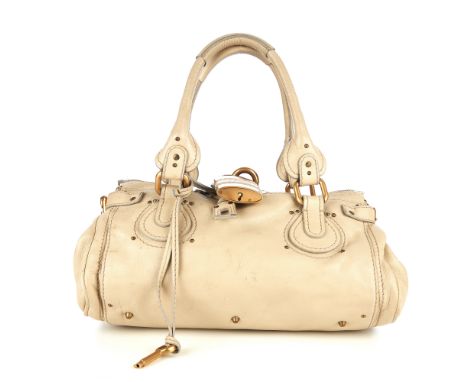 Chloe, a Paddington handbag, crafted from beige leather, with brushed gold-tone hardware, dual leather handles, maker's signa