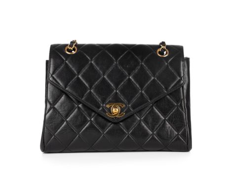 Chanel, a vintage Envelope Flap handbag, crafted from black quilted lambskin leather, with gold-tone hardware, double chain a