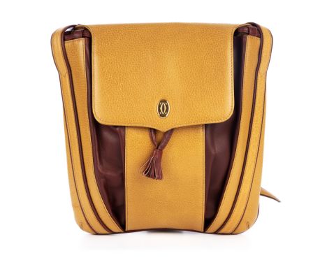 Cartier, a Must De Cartier mustard drawstring handbag, designed with a pebbled mustard yellow leather exterior and burgundy l