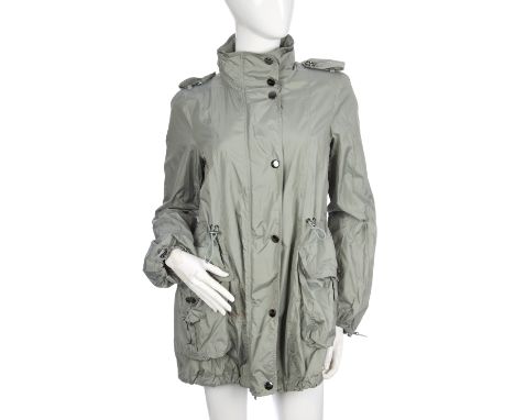 Burberry, a ladies green lightweight raincoat, featuring gunmetal grey buttoned epaulettes, fold-out zip fastened hood, elast
