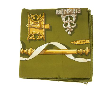 Hermes, a Ferronnerie silk scarf, designed by Cathy Latham and first issued in 1970, featuring decorative gold ironwork on an