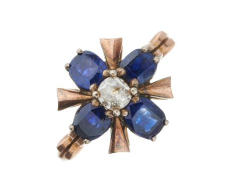 A mid 20th century gold, old-cut diamond and cushion-shape sapphire cluster dress ring, with grooved band, diamond estimated 