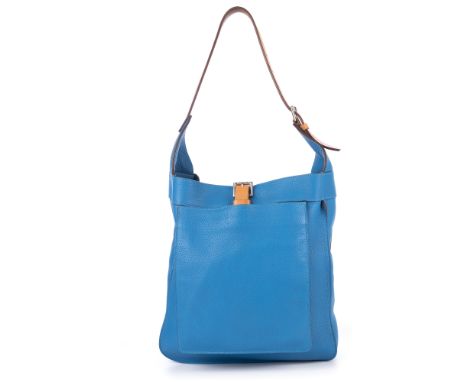 Hermes, a 2010 Marwari handbag, crafted from blue Clemence leather, featuring a front slip pocket, an adjustable tan leather 