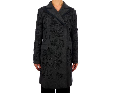 Prada, a limited edition grey beaded wool runway coat, designed with black bead embellishments throughout, notched lapel coll