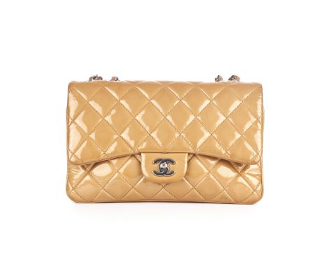 Chanel, a patent leather Single Flap handbag, designed with a diamond quilted beige patent leather exterior, with polished si