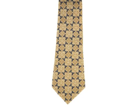 Hermes, a silk tie, featuring a smiling sun motif throughout in beige and blue tonesCondition- Overall good condition- No obv