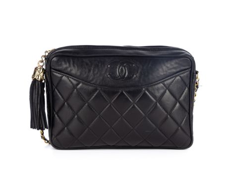 Chanel, a vintage Front Pocket camera bag, featuring a black diamond quilted leather exterior, with front slip pocket, gold-t
