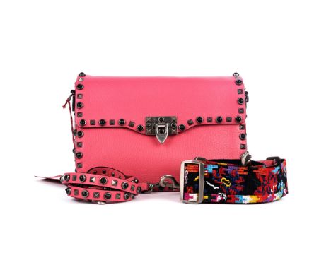 Valentino, a Guitar Rolling Rockstud handbag, crafted from grained hot pink leather with embellished studded trim, featuring 