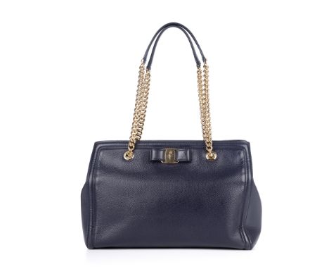 Salvatore Ferragamo, a Vara Bow handbag, crafted from blue grained leather with polished gold-tone hardware, featuring the ma