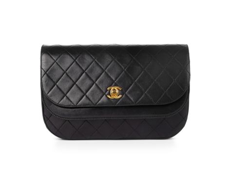 Chanel, a vintage Half Moon Double Flap handbag, designed with black diamond quilted lambskin leather exterior, gold-tone har