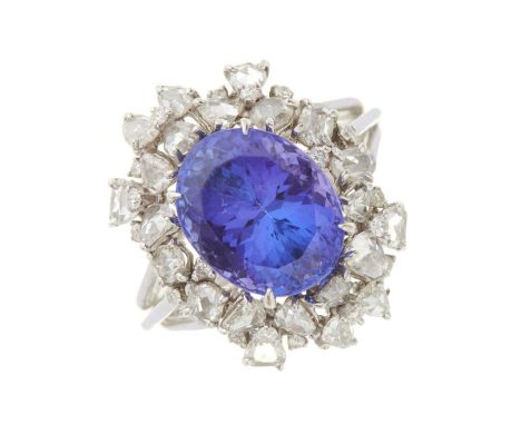 An 18ct gold oval-shape tanzanite and rose-cut diamond cocktail dress ring, with brilliant-cut diamond accents and grooved ba