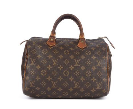 Louis Vuitton, a monogram Speedy 30 handbag, designed with the maker's monogram coated canvas exterior and natural cowhide le