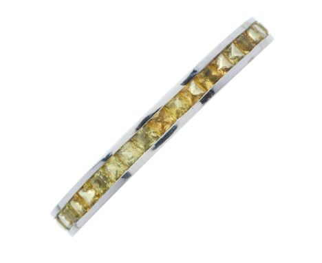 An 18ct gold calibre-cut yellow sapphire full eternity ring, estimated total yellow sapphire weight 1ct, hallmarks for Birmin