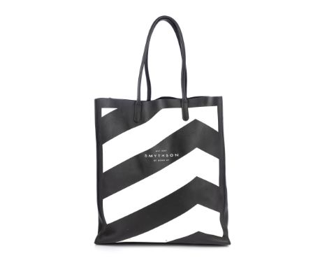 Smythson, a leather tote, featuring a black and white chevron pattern to the front and back, with tall rolled leather handles