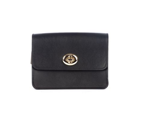 Coach, a small flap crossbody bag, crafted from smooth black leather with gold-tone hardware, featuring a thin chain-link cro