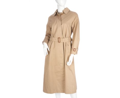 Burberry, a ladies classic trench coat, featuring front button fastenings, a waist belt and the maker's classic Nova check in
