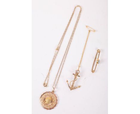 Three pieces of stamped yellow metal jewellery comprising an opal set bar pin, a seed pearl set anchor brooch, and a pendant 