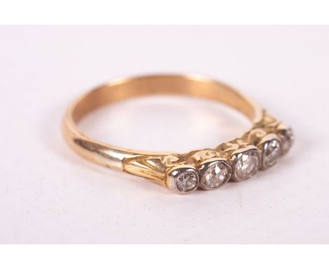 A five stone diamond set half hoop ring in yellow metal without marks. Gross weight approximately 2.5 grams. Size L (1)