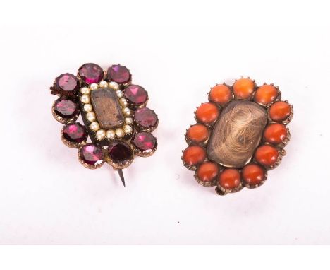 A pair of early 19th century yellow metal sentimental hair brooches - one is set with 12 coral cabochons and features a centr