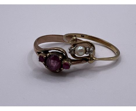 Two dainty dress rings. One a pink sapphire and yellow metal ring - unmarked - gross weight approximately 1.9 grams, size M. 