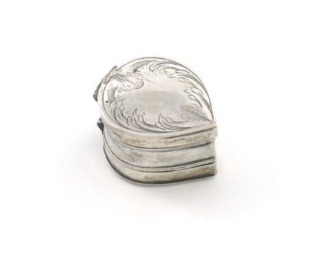 A late 17th century silver nutmeg grater, unmarked, circa 1690, tear drop form, the hinged cover and base engraved with folia