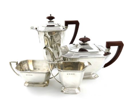 A four-piece Art Deco tea set, by The Adie Brothers, Birmingham 1937, tapering panelled rectangular form, scroll handles, on 