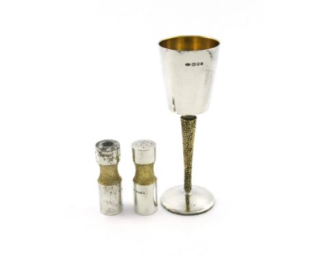 By Stuart Devlin, a modern parcel-gilt silver goblet, London 1971, tapering circular spot-hammered bowl, on a tapering textur