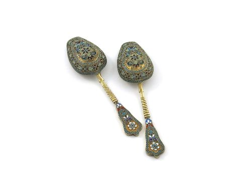 A pair of Russian silver-gilt and enamel caddy/sugar spoons, marked 84, the shovel-shaped bowls with foliate plique-a-jour en