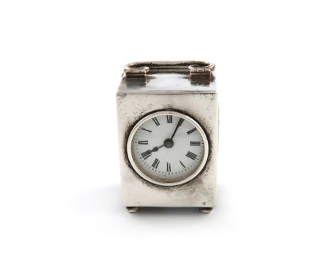 A silver clock, by the Goldsmiths and Silversmiths Company, London 1917, rectangular form, hinged scroll handle, on four bun 