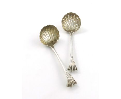 A George II silver Onslow pattern cream ladle and sugar sifting spoon, probably by Ebenezer Coker, London circa 1750, gilded 