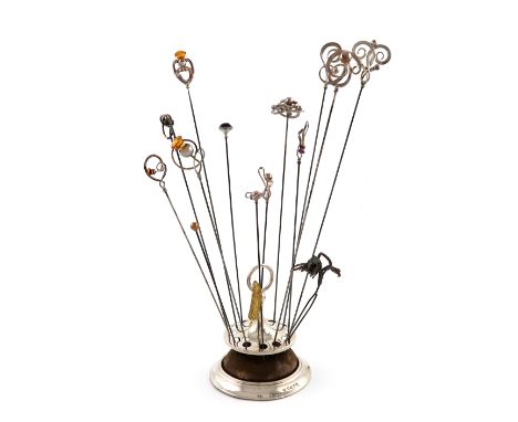 A collection of silver hat pins, comprising: eleven by Charles Horner, Chester, with scroll and ball decoration, three of whi