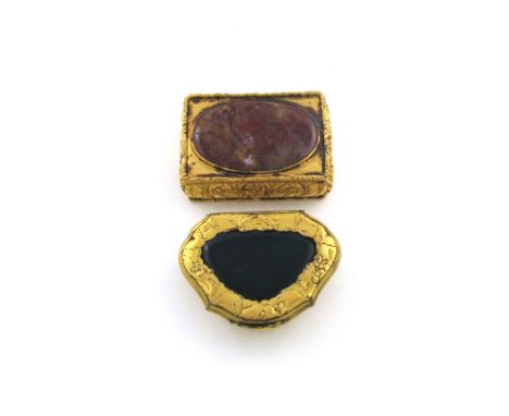 An 18th century gilt-metal mounted hardstone snuff box, circa 1750, cartouche form, the hinged cover with chased decoration a